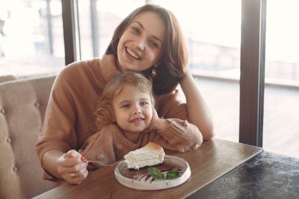 mother having breakfast with her child